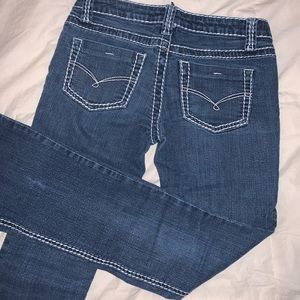 Jeans with white stitching.